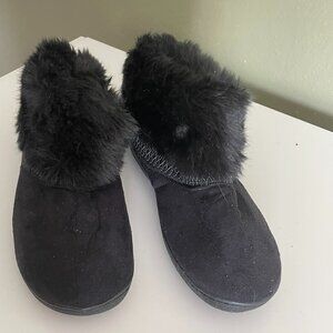 Pair of cozy black warm, comfy, fluffy slip ons